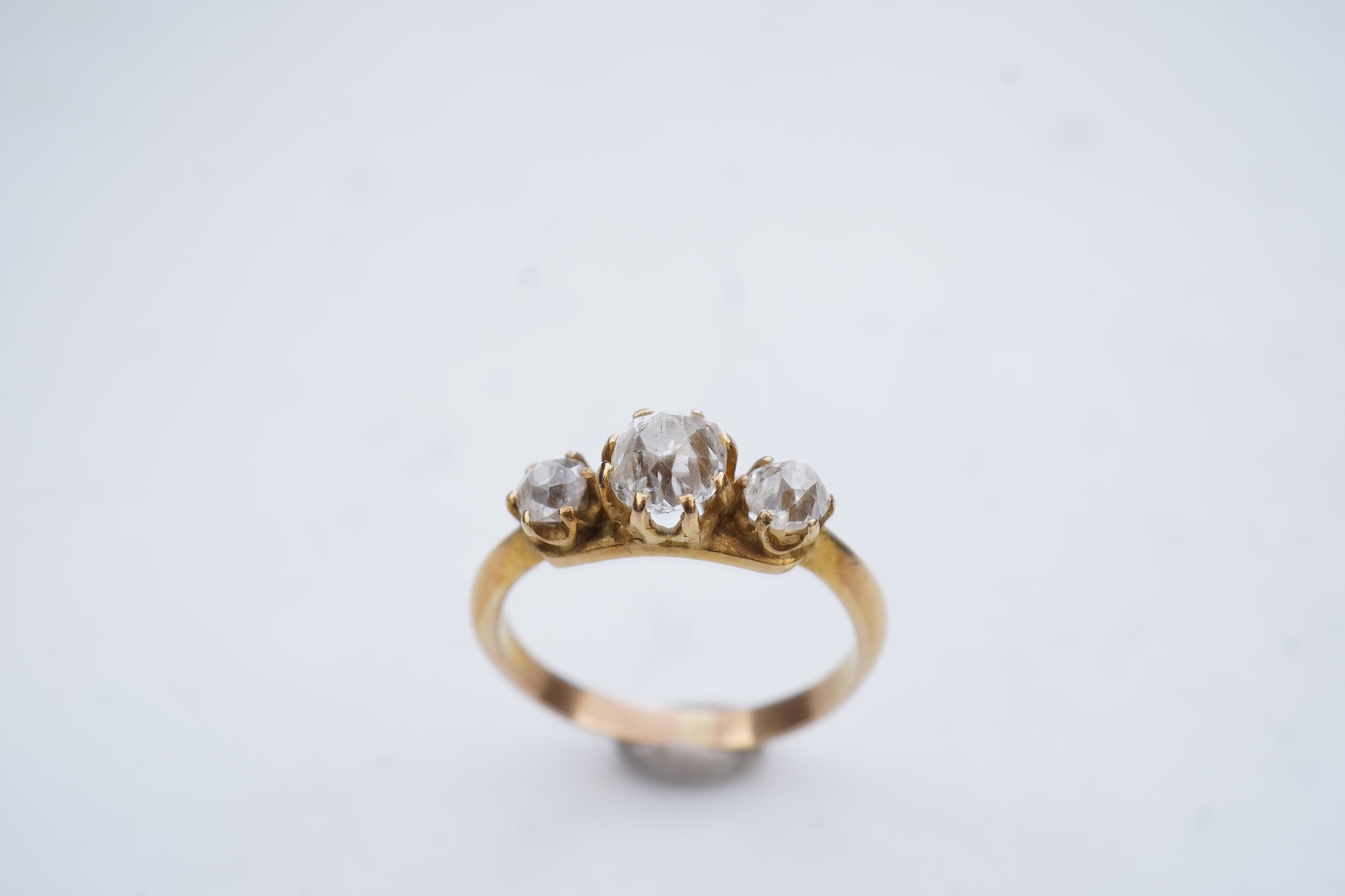 A three-stone diamond ring, early 20th century